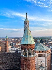 Cremona panorama of the cathedral bell tower from the Torrazzo tower at sunset - obrazy, fototapety, plakaty