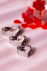 Valentine's day concept with red hearts and candies on wooden table