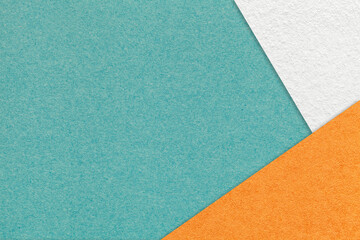Texture of craft cyan color paper background with white and orange border. Vintage abstract teal...