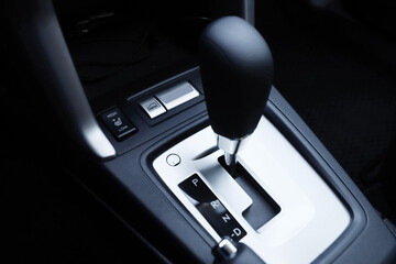 black interior of a modern car. Dashboard. Luxury leather steering wheel. Auto controls. Car doors...