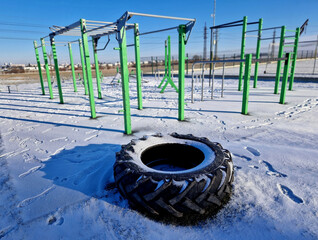 fitness sports fields with stainless steel tools resemble torture tools with chains and handles....