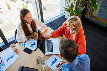 Businessman and businesswomen having discussion at desk
