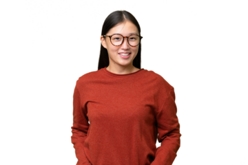 Young Asian woman over isolated background suffering from pain in shoulder for having made an effort