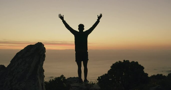 Hands up, sunset or man in hiking celebration on mountain in nature adventure for outdoor fitness. Night, view or back of excited hiker with arms raised for success, gratitude or goal achievement