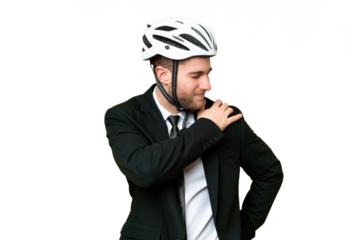 Business person with a bike helmet over isolated chroma key background suffering from pain in shoulder for having made an effort