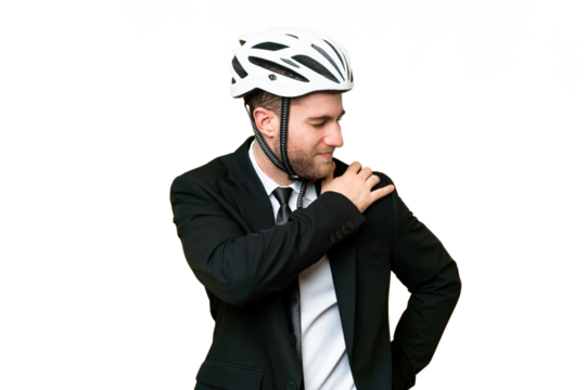 Business person with a bike helmet over isolated chroma key background suffering from pain in shoulder for having made an effort
