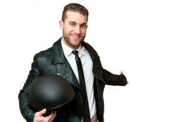 Business man with a motorcycle helmet over isolated chroma key background extending hands to the side for inviting to come
