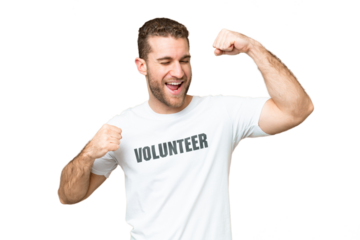 Young volunteer man over isolated chroma key background celebrating a victory