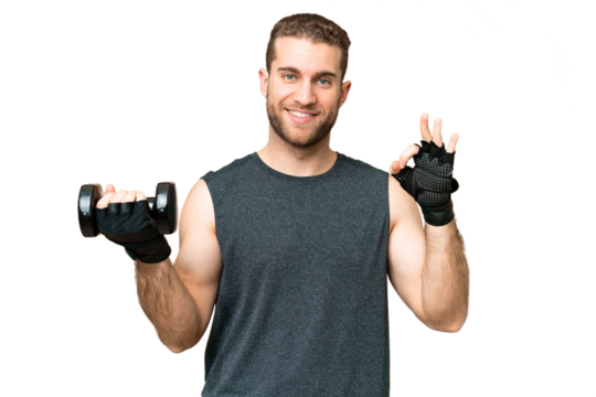 Young sport man making weightlifting over isolated chroma key background showing ok sign with fingers