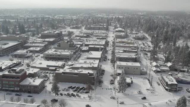 Aerial of downtown Bend Oregon after heavy snowfall | 4K