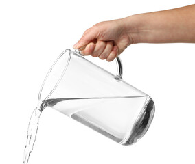 Woman pouring water from jug on white background, closeup