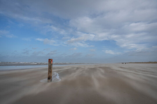 Netherlands, Friesland, Terschelling, Distance marker on empty beach