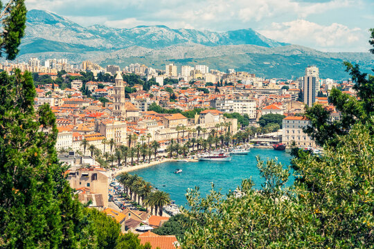 Croatia, Split-Dalmatia County, Split, Coastal cityscape with treelined promenade
