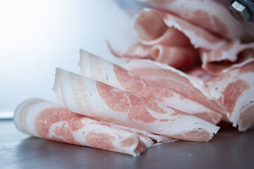 Pork that has been wrapped until it becomes a ball. Slide through Meat automatic slicer into round discs Ready to serve with sukiyaki or shabu.