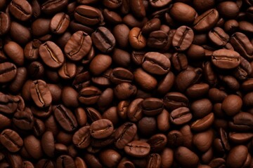 Close up view of dark fresh roasted coffee beans on coffee beans background. Closeup of coffee beans scattered background