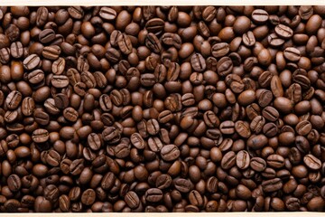 Obraz premium Close up view of dark fresh roasted coffee beans on coffee beans background. Closeup of coffee beans scattered background