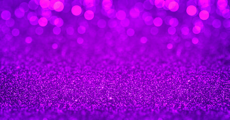 Sparkling purple magenta glitter background with bokeh. Closeup view, dof. Pattern with shining fine purple sequins. Festive luxury magenta background, backdrop, texture. Design element