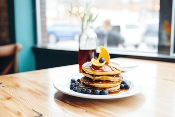 blueberry pancakes with a side of maple syrup - obrazy, fototapety, plakaty