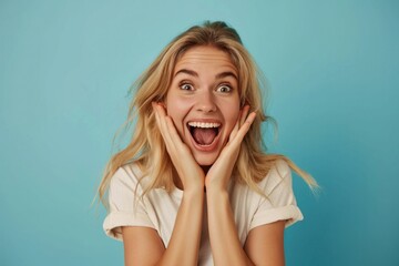 excited cute blond woman with amazed facial expressions, keep hands near face