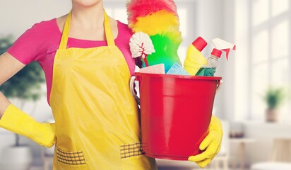 portrait  woman hold cleaning bucket for housekeeping