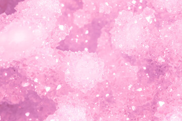 Amethyst pink crystals. Gems. Mineral crystals in the natural environment. Texture of precious and semiprecious stones. Seamless background with copy space colored shiny surface of precious stones.
