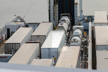 trucks loaded into ferry for transportation