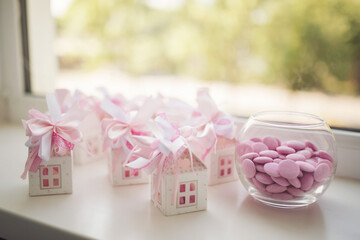 White and Pink box for candies with a tape. Present at the wedding. wedding gifts for wedding guest. Sweets. a small gifts for guests.
