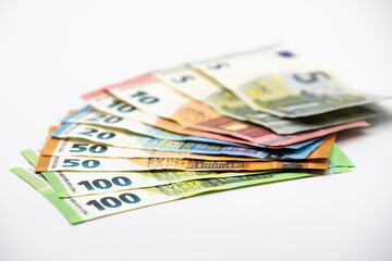 Obraz na płótnie Canvas Pile of euro banknotes of 100, 50, 20, 10 and 5 euros. White background
