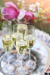 Champagne glasses on silver tray