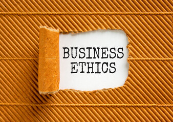 Business ethics symbol. Concept words Business ethics on beautiful white paper. Beautiful brown...