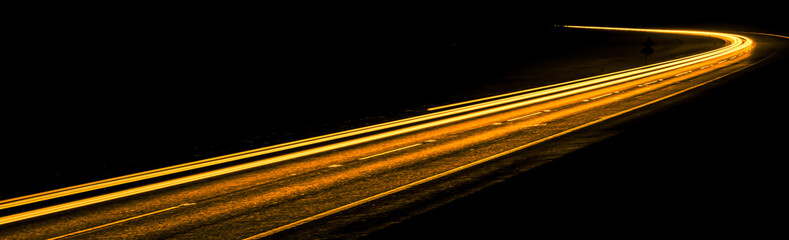 orange car lights at night. long exposure