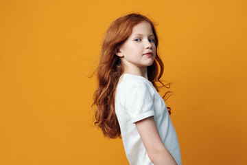 Portrait red childhood ginger expression face little children female isolated indoor background...