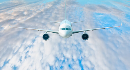 Passenger airplane in the clouds - travel by air transport 