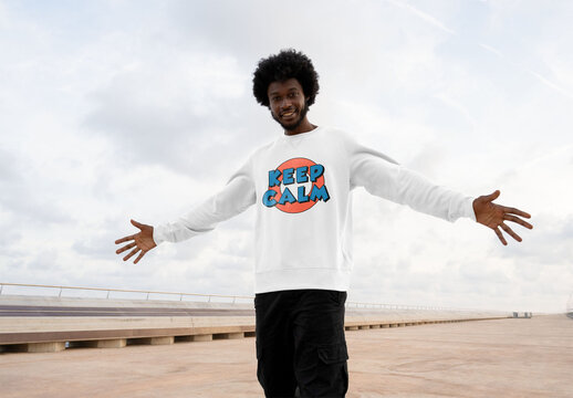 Mockup of man wearing customized sweatshirt, arms out