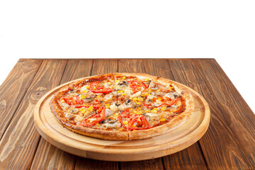 delicious pizza with chicken, mushrooms, cheese, tomatoes and corn on a wooden background