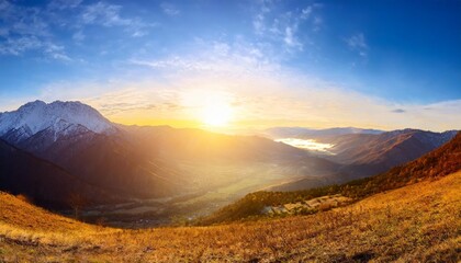 panoramic view of the sunrise in the mountains valley