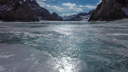 Fototapeta na wymiar High-altitude frozen lake, lake in ice, lake of ice, Kyrgyzstan