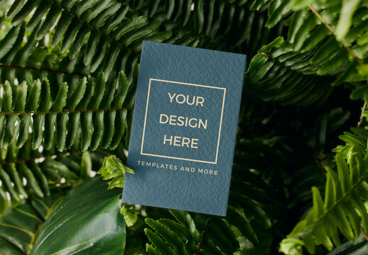 Mockup of customizable vertical business card in ferns