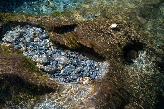 Ripples and Stone Patterns in the clear water of Afon Cwm Llan, Cwm Llan, The Watkin Path, Snowdonia National Park (Eryri), North Wales