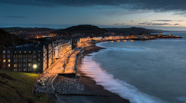 Aberystwyth Promenade, at dusk, taken with slow shutter speed, on the west coast of Wales, Aberystwyth, Ceredigion, Wales