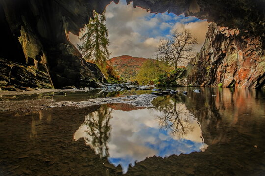 Sunshine and showers with autumn colours from Rydal Cave, Lake District National Park, UNESCO World Heritage Site, Cumbria, England