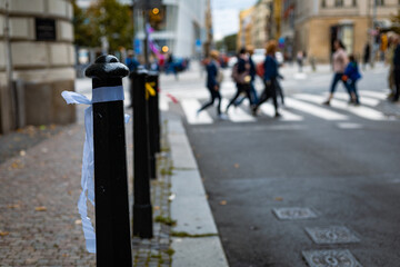 ribbon hanging on a street pole