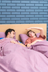 As the night unfolds, a wife sits awake, unable to sleep, the rhythmic symphony of her husband's...