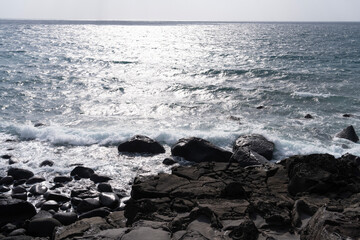 waves on the beach with the horizon