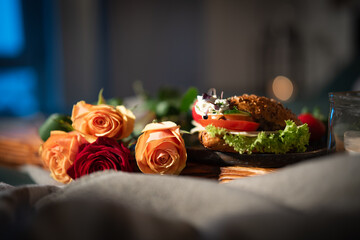 Romantic breakfast with roses on bed. Background for valentins day ore mothers day with space for...