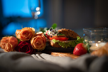 Romantic breakfast with roses and champagne on bed. Background for valentins day ore mothers day...
