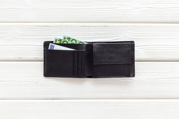 Black male wallet with Euro banknotes. Counting money, economy concept
