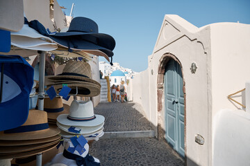 Street with shops and souvenirs for tourists in Oia, Santorini Island. Santorini is a volcanic...