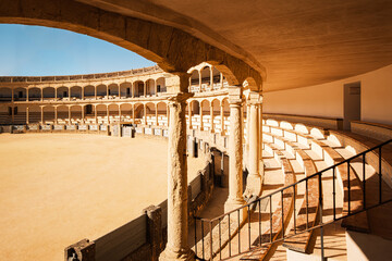 Plaza de Toros (Bullring) in Ronda, Spain. A popular and historic bullring known for its elegant neo-classical architecture featuring a double order of lowered arches.