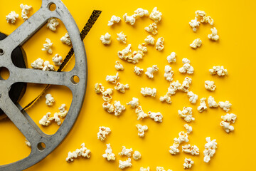 Cinema concept with film reels and popcorn. Movie background